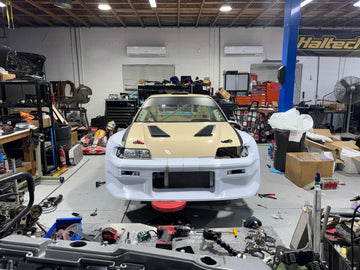 Front of the CR-X in the shop with the printed widebody kit fitted