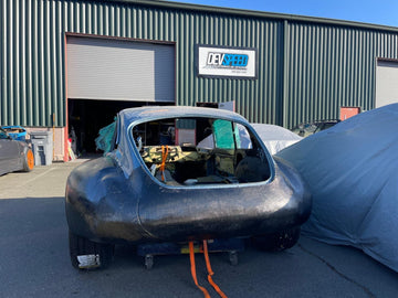 E-Type outside DevSpeed with the rear flares skinned in carbon fiber