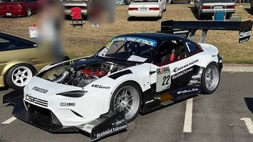 The finished HyperMiata in Global Time Attack livery at a car show, with its printed aero bodywork