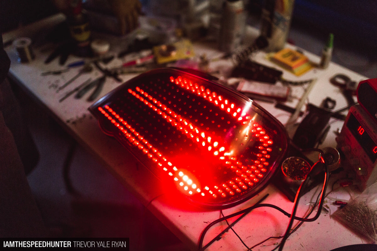 LED tail light being built on the bench, lit red